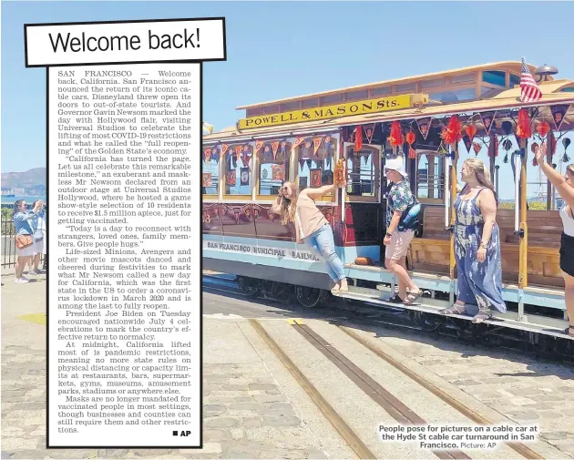  ?? Picture: AP ?? People pose for pictures on a cable car at the Hyde St cable car turnaround in San Francisco.