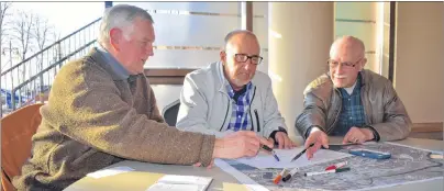  ?? JEREMY FRASER/CAPE BRETON POST ?? From left, David Young, Craig Boudreau and Bernie Gillis discuss the possible location for the new Nova Scotia Community College Marconi Campus in downtown Sydney. Ekistics Planning and Design held an open house for residents on Wednesday to receive...