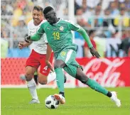  ?? Picture: IAN MACNICOL/GETTY IMAGES ?? FLYING THE FLAG: Senegal’s Mbaye Niang controls the ball in their match against Poland