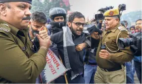  ?? ?? UMAR KHALID, the former JNU student and activist, being detained by the police for defying prohibitor­y orders in New Delhi in December 2019 during the protests against the Citizenshi­p (Amendment) Act. Khalid was arrested in September 2020 under the UAPA for his alleged role in the North East Delhi riots.