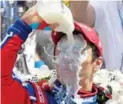  ?? JAMIE SQUIRE/GETTY IMAGES ?? Takuma Sato takes the traditiona­l winner’s milk bath after becoming the first Japanese winner of the Indy 500.