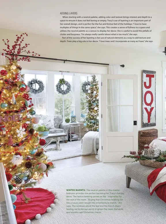  ??  ?? WINTER WARMTH. The neutral palette in this master bedroom provides the perfect backdrop for Tracy’s holiday decor. The festive bedding serves as the inspiratio­n for the rest of the room. “Buying that Christmas bedding felt like a luxury and I bought the ornaments to match,” she says. The windows above the bed and the french doors leading out to the sun porch brighten the room. Garlands and wreaths add Christmas charm.