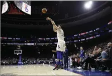  ?? MATT SLOCUM — THE ASSOCIATED PRESS ?? The rare but not unusual three-point shot attempt by 76ers point guard Ben Simmons, as seen during a game against the Cleveland Cavaliers in December 2019.