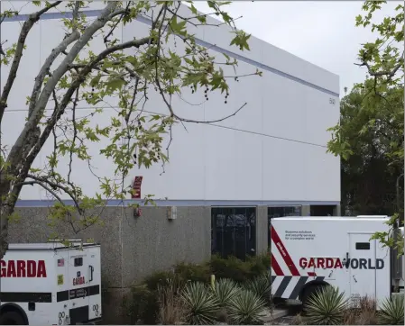  ?? RICHARD VOGEL — THE ASSOCIATED PRESS ?? Armored trucks are parked outside the GardaWorld facility in the Sylmar section of Los Angeles on Thursday, April 4, 2024. Thieves stole as much $30 million in an Easter Sunday burglary at a Los Angeles money storage facility in one of the largest cash heists in city history.