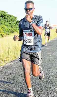  ?? Pictures: SUPPLIED ?? TAKING THE LEAD: Local runners Dumisa Kingana, pictured, and Vuyisani Nobi have qualified for the Two Oceans Marathon which is set for April, after having taken part in the Buffs Marathon earlier this year