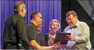  ?? PHOTOS BY DYLAN RATNARAJAH ?? From left, David Hawthorne, Nick Anderalli, Marjorie Hawthorne, Kathryn Dimmel, and Timothy Watson look on as they are presented with the mayor’s official proclamati­on at the Oneida Jazz Festival.