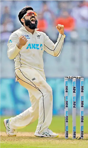  ?? — AP ?? New Zealand spinner Ajaz Patel celebrates the dismissal of India’s Mohammed Siraj on Day Two of the second Test in Mumbai on Saturday.