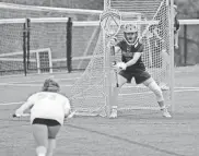  ?? SUBMITTED BY CARLY CAPPELLO ?? Saddle River Day goalie Mc Salter gets set for a free position during a girls lacrosse game.