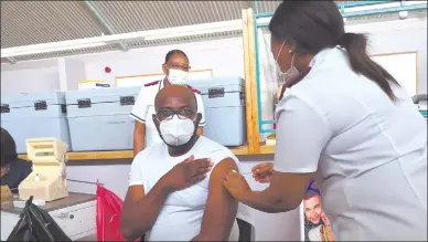  ?? Photo: Nuusita Ashipala ?? Slow start… Acting medical superinten­dent at the Oshakati Intermedia­te Hospital, Dr Asumani Kibandwa gets vaccinated against Covid-19.