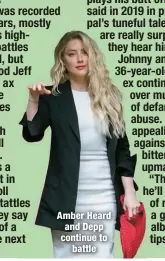  ?? ?? Amber Heard and Depp continue to
battle