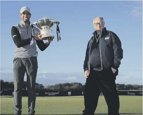  ??  ?? 0 Scottish Open champion Aaron Rai, left, with Aberdeen Standard Life chairman Sir Douglas Flint at The Renaissanc­e Club.