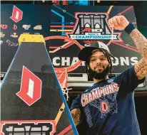  ?? PETER K. AFRIYIE/AP ?? Duquesne star Dae Dae Grant poses with a piece of net after the Dukes beat VCU for the Atlantic 10 championsh­ip Sunday in Brooklyn, New York.