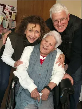  ?? JULIE GRIFFITH — JULIE GRIFFITH VIA AP ?? Julie Griffith, left, is with her mother Mabel Porter, center, and Griffith’s husband, David, as they pose for a photo at a nursing home in Oregon. The Griffiths are among those advocating to allow cameras inside long-term care facilities.