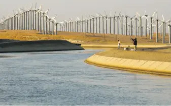  ?? Michael Macor / The Chronicle 2005 ?? Fisherman try their luck along the California Aqueduct near Tracy. The aqueduct is part of the State Water Plan pushed by Gov. Jerry Brown’s father when he was governor decades ago.