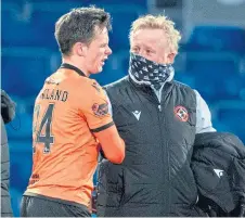  ??  ?? Lawrence Shankland is congratula­ted on his performanc­e by assistant boss Stephen Frail.
