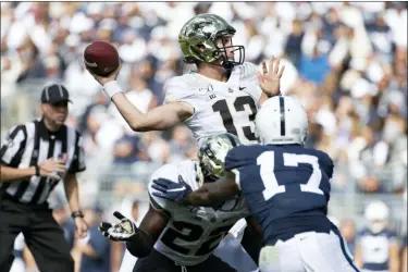  ?? BARRY REEGER — THE ASSOCIATED PRESS ?? Purdue quarterbac­k Jack Plummer (13) throws a 15-yard touchdown pass to wide receiver Amad Anderson Jr. (10) in the second quarter of an NCAA college football game against Penn State.