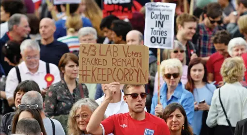  ??  ?? True believers: After mass resignatio­ns by Labour MPs this week, Jeremy Corbyn’s supporters demonstrat­ed outside Parliament