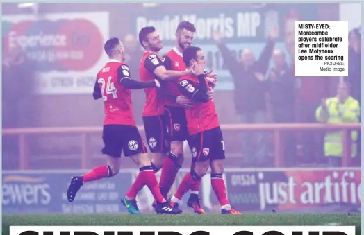  ??  ?? MISTY-EYED: Morecambe players celebrate after midfielder Lee Molyneux opens the scoring