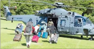  ?? SERGEANT SAM SHEPHERD/NEW ZEALAND DEFENCE FORCE/AFP ?? A New Zealand Defence Force helicopter evacuates tourists yesterday from Kaikoura stranded by the earthquake.