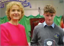  ??  ?? Junior GAA Player of the year Ryan Leahy with school principal Áine Máire Ní Fhaolain.