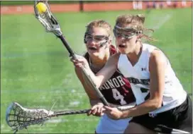  ?? DIGITAL FIRST MEDIA FILE ?? Ridley’s Emily Johnston, right, seen here battling with Radnor’s Eliza Azzarano last season, scored eight goals but went out with an injury Saturday in a tough Green Raiders overtime loss to Henderson.