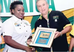  ?? CONTRIBUTE­D ?? Dadre-Ann Graham, sales representa­tive, GraceKenne­dy, received the exhibitor award for the Best Environmen­tally Friendly Exhibit/Products from Metry Seaga, president of the Jamaica Manufactur­ers, Associatio­n, at Expo Jamaica 2016, held at the National...
