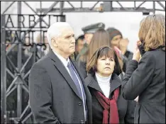  ?? MATTHIAS SCHRADER / ASSOCIATED PRESS ?? Vice President Mike Pence (left) and his wife, Karen, listen to a guide during a visit to the former Nazi concentrat­ion camp in Dachau near Munich, Germany, on Sunday, one day after he attended the Munich Security Conference.