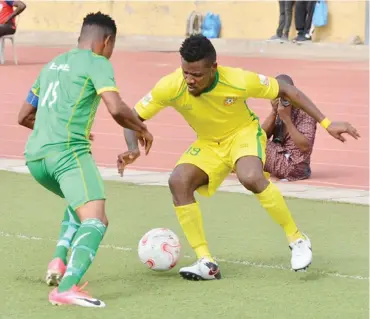  ??  ?? Deberechi Ayanwu of Kwara United (R) tries to dribble pas Efe Enabulele of Bendel Insurance during their match in the 2018/2019 Nigeria Profession­al Football League season