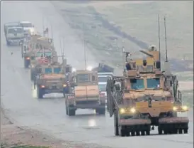  ?? AFP ?? File photo of a convoy of US military vehicles in Syria's northern city of Manbij.