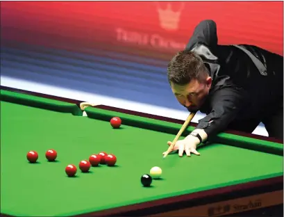  ??  ?? Kyren Wilson, above, sealed a comeback over Jack Lisowski at the Masters in London