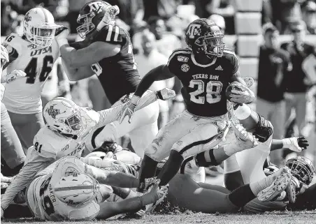  ?? Bob Levey / Getty Images ?? Running back Isaiah Spiller (28) matched two Texas A&M single-game freshman rushing records with 217 yards and three TDs.