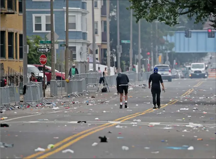  ?? STUART CAHILL — BOSTON HERALD ?? The intersecti­on of Talbot Avenue and Blue Hill Avenue hours after seven people were shot in the area during the J’ouvert Parade portion of the Caribbean Carnival on Saturday morning in Dorchester.