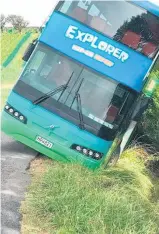  ??  ?? The explorer bus caught in a ditch on Waiheke.