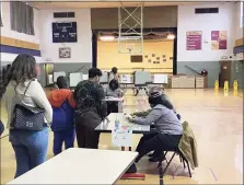  ?? Meghan Friedmann / Hearst Connecticu­t Media ?? Voters go to the polls at the Hamden Collaborat­ive Learning Center last year.