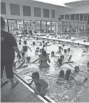  ?? SCOTT MORGAN/FOR THE REGISTER ?? A capacity crowd fills the pool on March 18, 2015, during the Spring Break Carnival at the Urbandale Indoor Public Pool.
