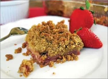  ?? PHOTOS BY EMILY RYAN ?? Strawberry-rhubarb coffee cake makes a sweet breakfast or snack.