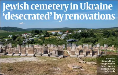  ?? PHOTO: DMITRY POLYUKHOVI­CH ?? Historic: Stones lie on the ground at the centurieso­ld cemetery in Sataniv