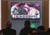  ?? GETTY IMAGES ?? South Koreans watch a TV report at a Seoul railway station after North Korea triggered a series of explosions in what it claimed to be the demolition of the tunnels at its nuclear test site.