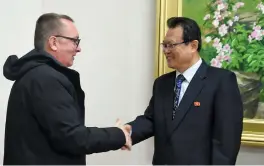  ?? — AFP ?? Senior UN official Jeffrey Feltman ( L) shakes hands with North Korean vice- foreign minister Pak Myong Guk at People’s Palace of Culture in Pyongyang on Wednesday.