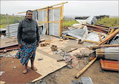  ?? Picture: ALAN EASON ?? NOTHING LEFT: Zoliswa Mqongwana stands in front of her destroyed shack in NU7 Mdantsane