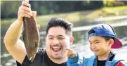  ?? PHOTOS: PETER MCINTOSH ?? Catch of the day . . . John and son Clyde Barcos celebrate after Clyde caught a rainbow trout on his first cast at the Southern Reservoir on Saturday.