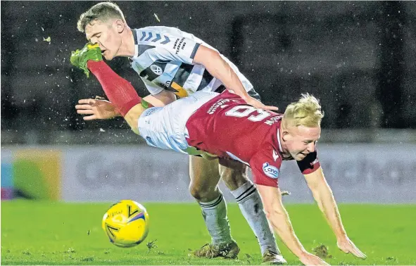  ?? ?? Arbroath’s Nicky Low takes a tumble during the loss against Ayr United at Somerset Park.