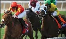  ??  ?? WINNER: Wayne Lordan, aboard Iridessa (left) edges out Vasilika to win the Breeders’ Cup Filly and Mare Turf