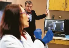  ?? Mark Mulligan / Staff photograph­er ?? Hotez and his colleague, Dr. Maria Elena Bottazzi, are working to develop a vaccine at the National School of Tropical Medicine.