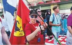  ?? Virendra Saklani/Gulf News ?? Seppo Rastas from Finland with the Ferrari flag at the Yas Marina Circuit yesterday.