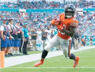  ?? JOEL AUERBACH/AP ?? Bears running back Tarik Cohen scores on a 21-yard run in the third quarter Sunday.