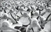  ?? Sam Panthaky
AFP/Getty Images ?? STUDENTS in Ahmedabad attend a workshop. An official described yoga as India’s “best soft power.”