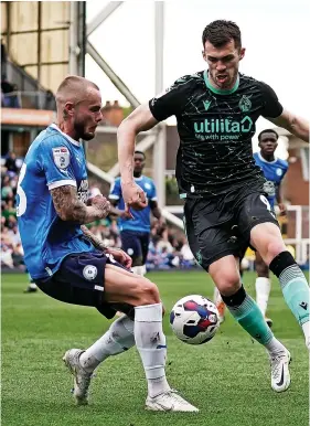  ?? ?? John Marquis battles for the ball with Peterborou­gh’s Dan Butler