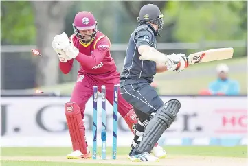  ?? — AFP photo ?? West Indies wicketkeep­er Shai Hope (L) stumps New Zealand’s Tom Latham (R) during the third one-day internatio­nal (ODI) cricket match between New Zealand and the West Indies at Hagley Oval in Christchur­ch on December 26, 2017.