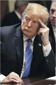  ?? NICHOLAS KAMM / AFP / GETTY IMAGES ?? U.S. President Donald Trump listens during a cabinet meeting Wednesday at the White House in Washington.